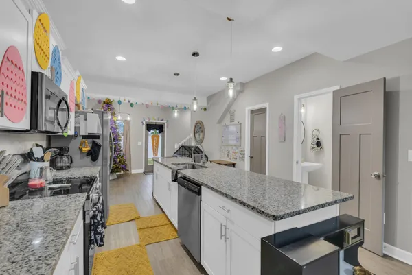 a kitchen with sink and refrigerator
