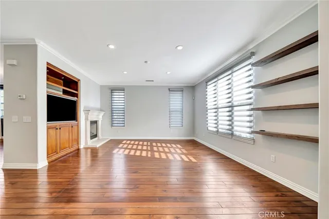 a large kitchen with stainless steel appliances kitchen island granite countertop a large counter top a stove a sink and a refrigerator