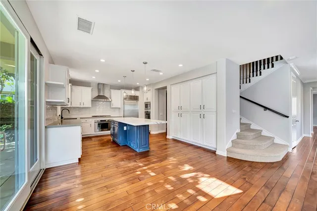 a bathroom with a sink toilet and a mirror