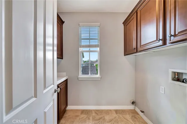 a view of a patio with a table and chairs next to a yard