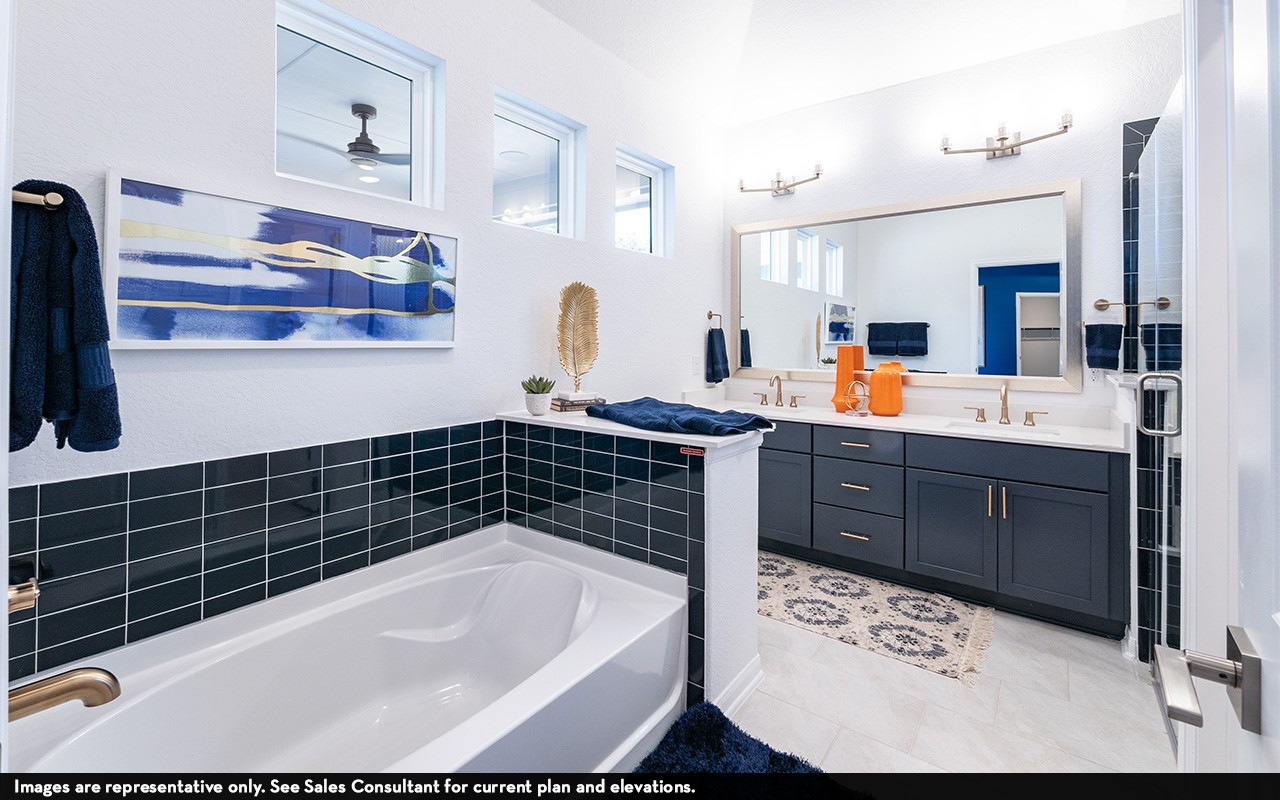 7906 Jasper Mdws Way Angleton, TX 77515 - Photo 12 of 18 a bathroom with a bathtub sink and mirror