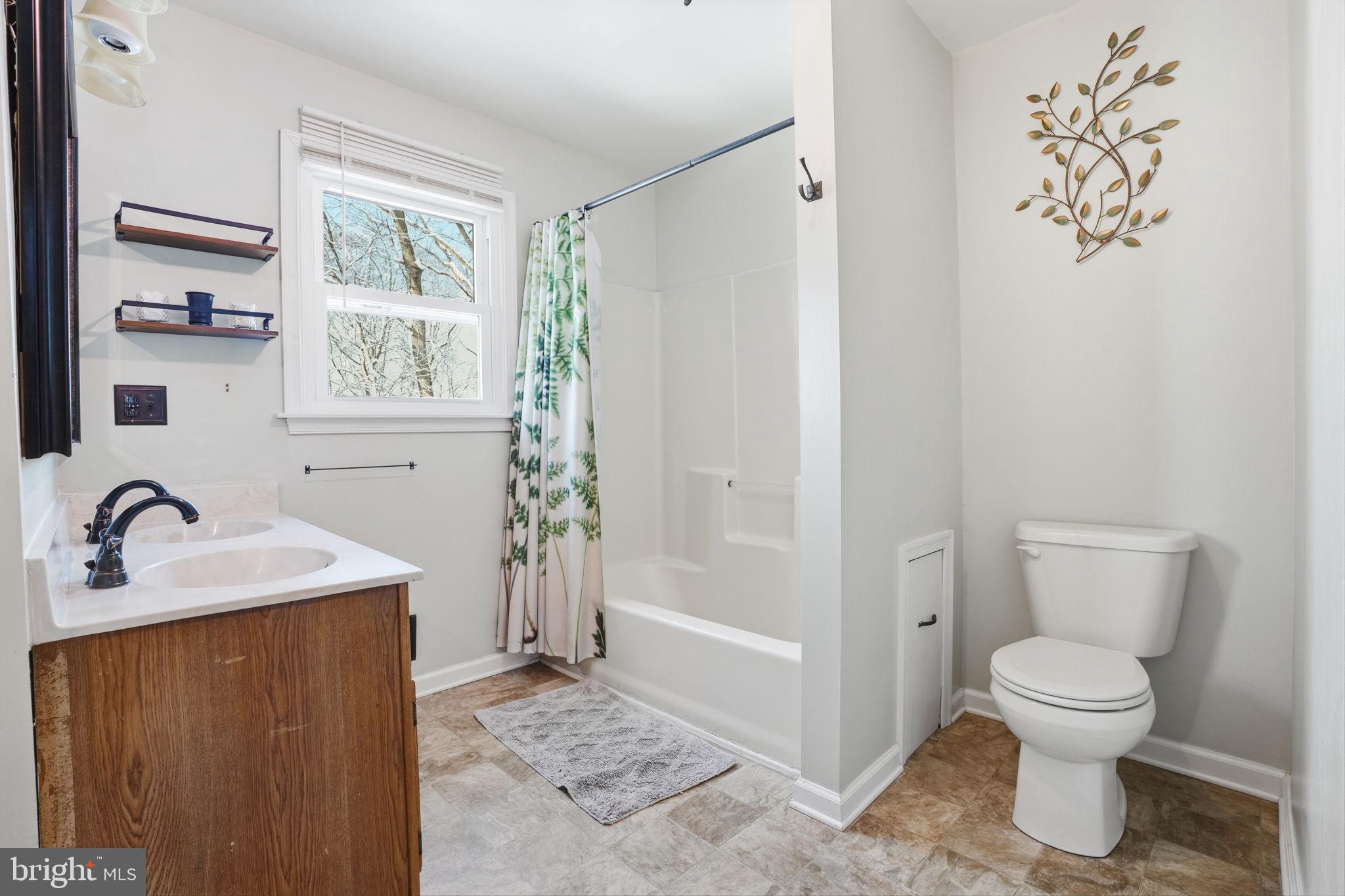 937 High Pointe Circle Langhorne, PA 19047 - Photo 16 of 47 a bathroom with a granite countertop sink toilet and shower