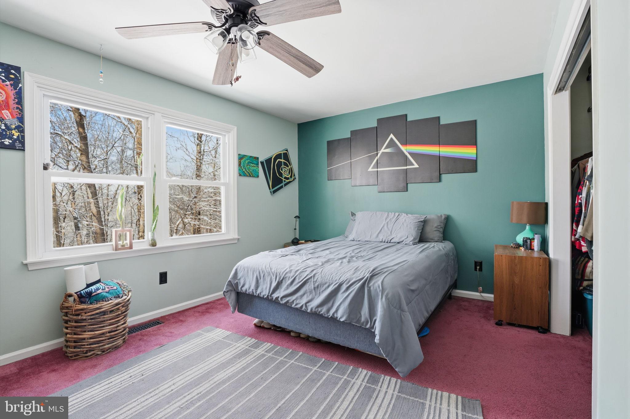 937 High Pointe Circle Langhorne, PA 19047 - Photo 26 of 47 a bedroom with a bed and a chandelier