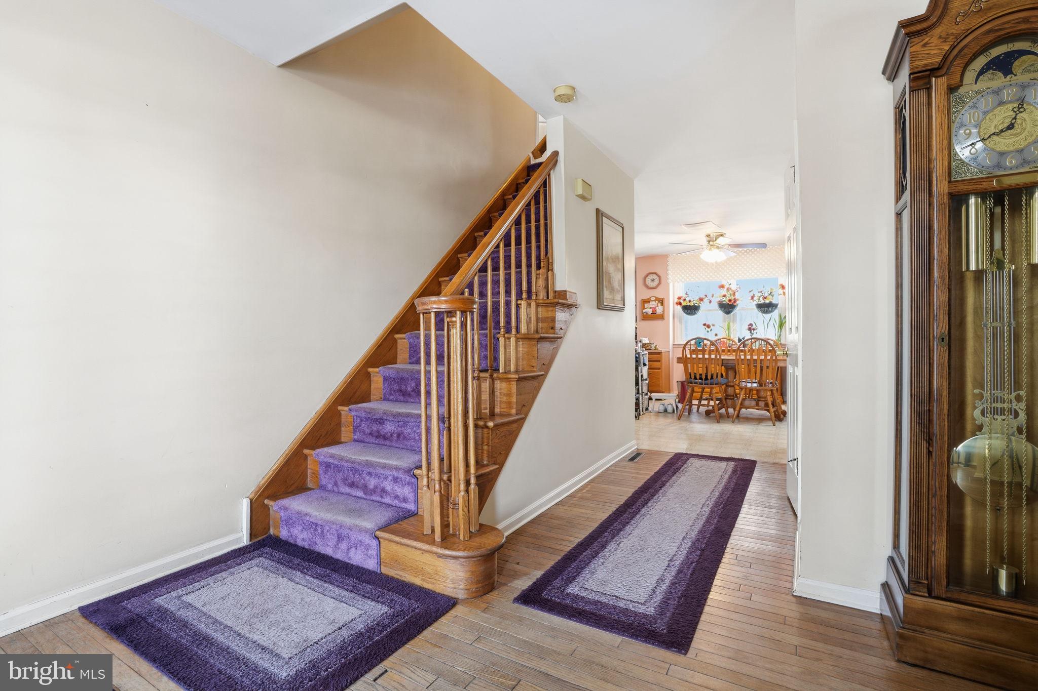 937 High Pointe Circle Langhorne, PA 19047 - Photo 4 of 47 a view of a hallway with wooden floor and staircase