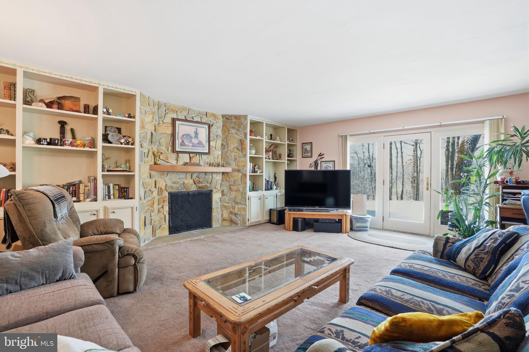 937 High Pointe Circle Langhorne, PA 19047 - Photo 7 of 47 a living room with furniture a fireplace and a flat screen tv