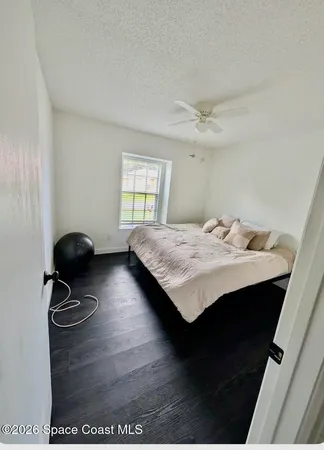 a living room with a table chairs and a stove