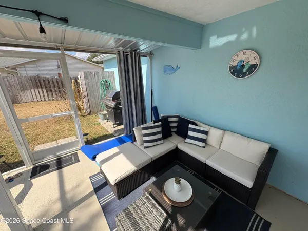 a view of a workspace with furniture