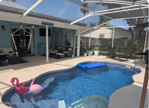 a view of a house with a yard porch and sitting area