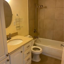 6406 Schiller Street Houston, TX 77055 - Photo 4 of 10 a bathroom with a sink a toilet and shower