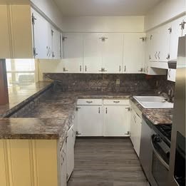6406 Schiller Street Houston, TX 77055 - Photo 6 of 10 a kitchen with a sink stove and cabinets