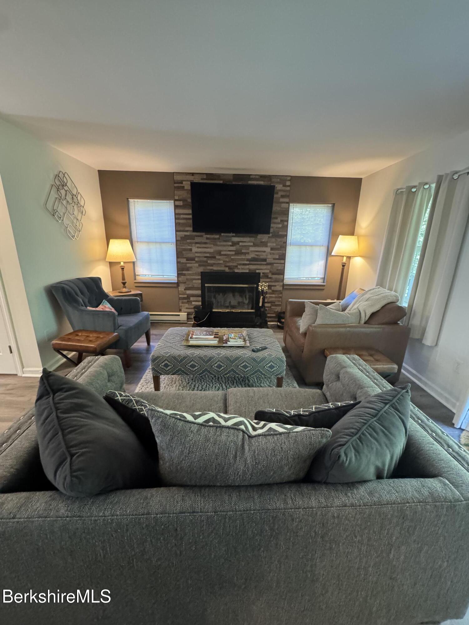 37 Corey Road, Unit 9061 Hancock, MA 01237 - Photo 12 of 30 a living room with furniture and a fireplace