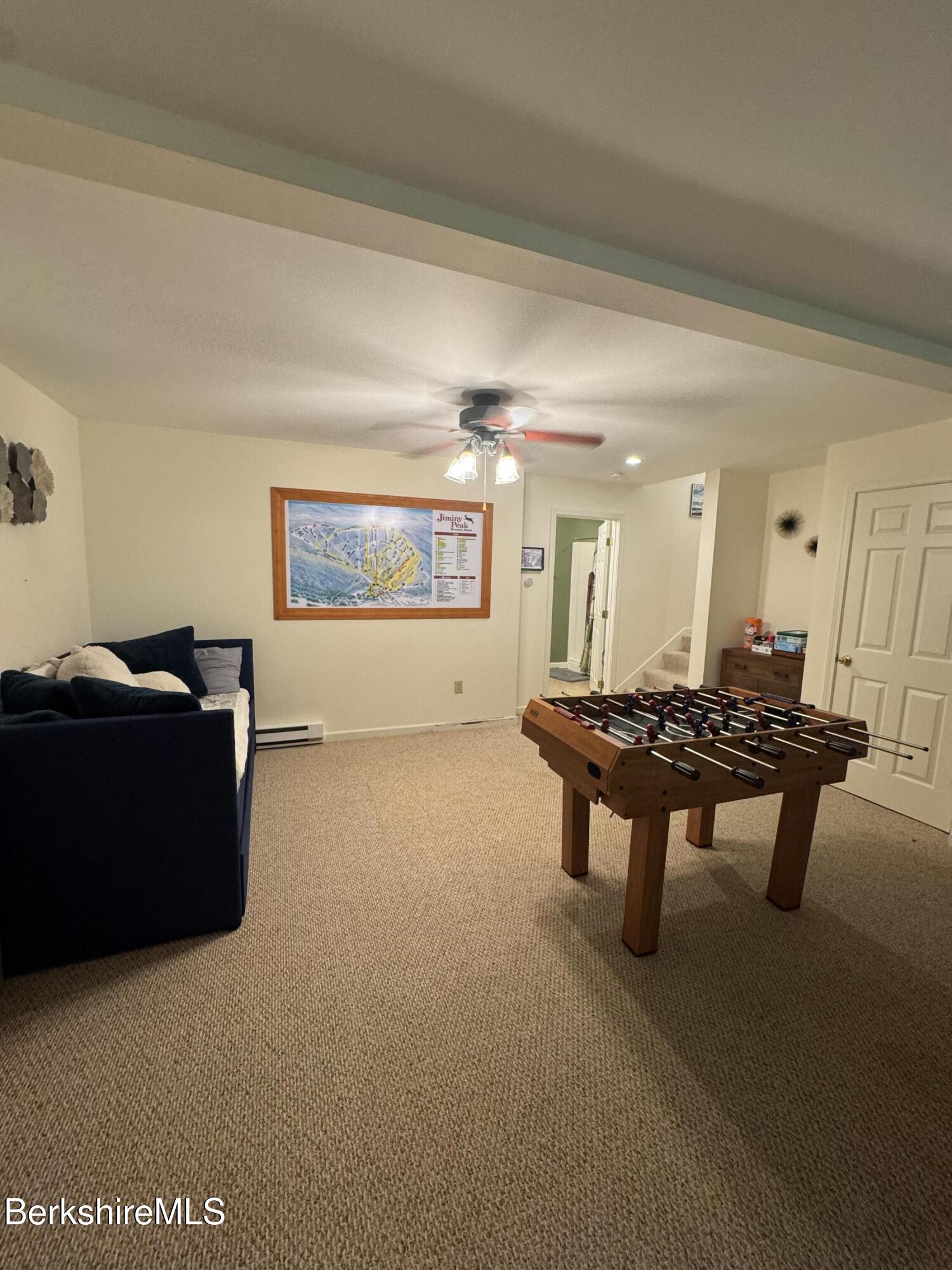 37 Corey Road, Unit 9061 Hancock, MA 01237 - Photo 19 of 29 a living room with furniture a rug and a window