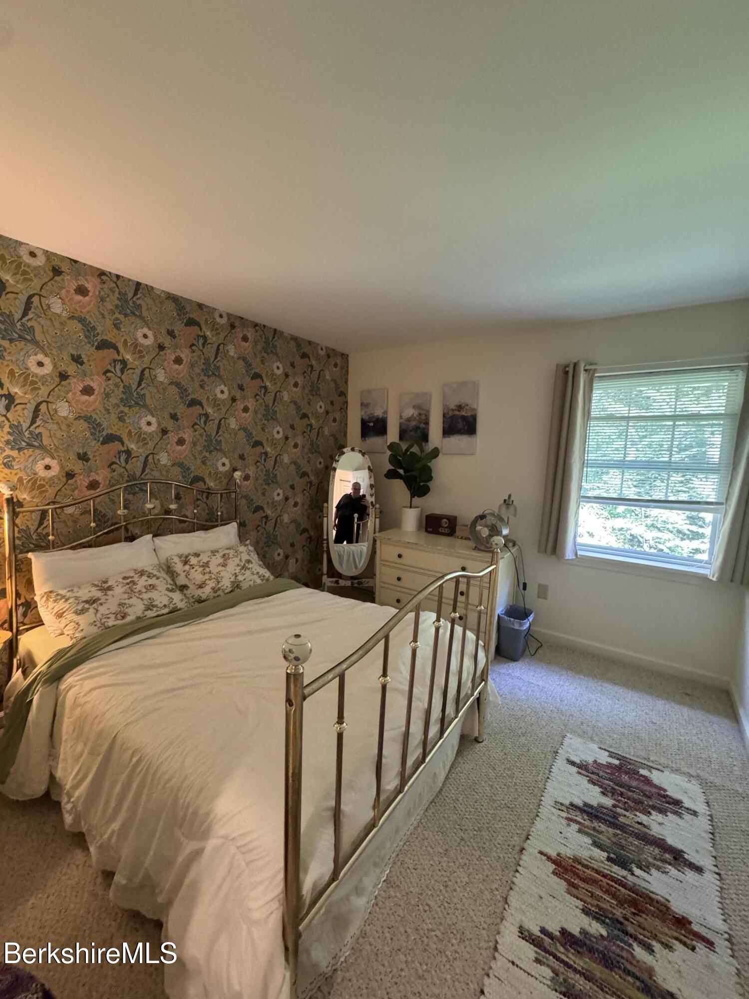 37 Corey Road, Unit 9061 Hancock, MA 01237 - Photo 26 of 30 a bed sitting in a bedroom next to a window