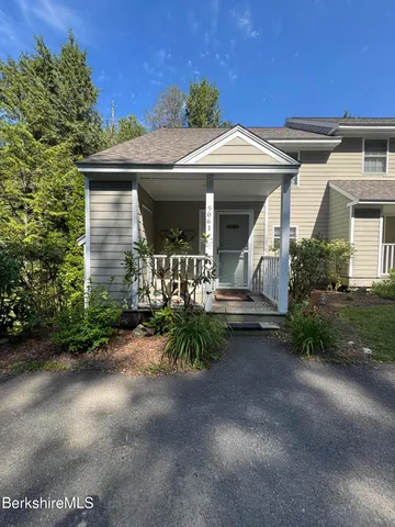 a front view of a house with yard