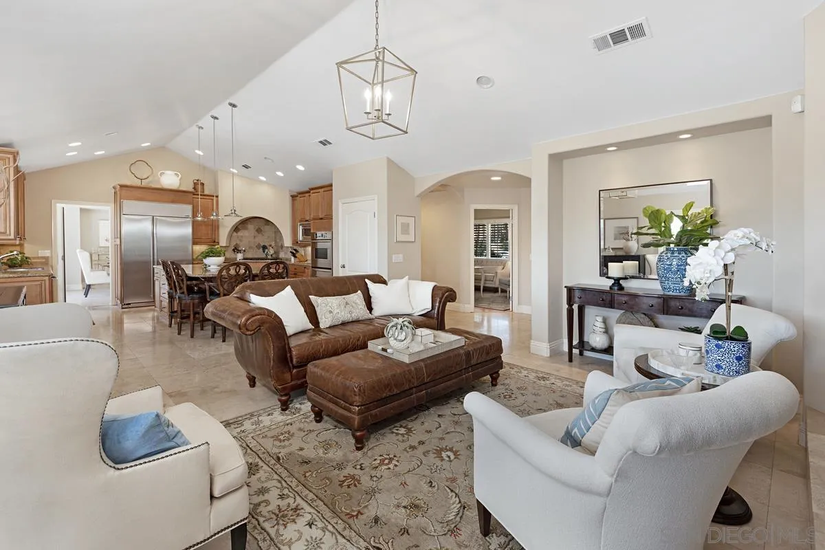 14258 Palisades Drive Poway, CA 92064 - Photo 13 of 40 a living room with furniture kitchen view and a chandelier