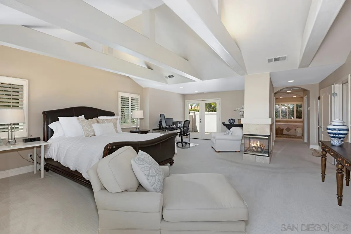 14258 Palisades Drive Poway, CA 92064 - Photo 16 of 40 a spacious bedroom with a bed and window