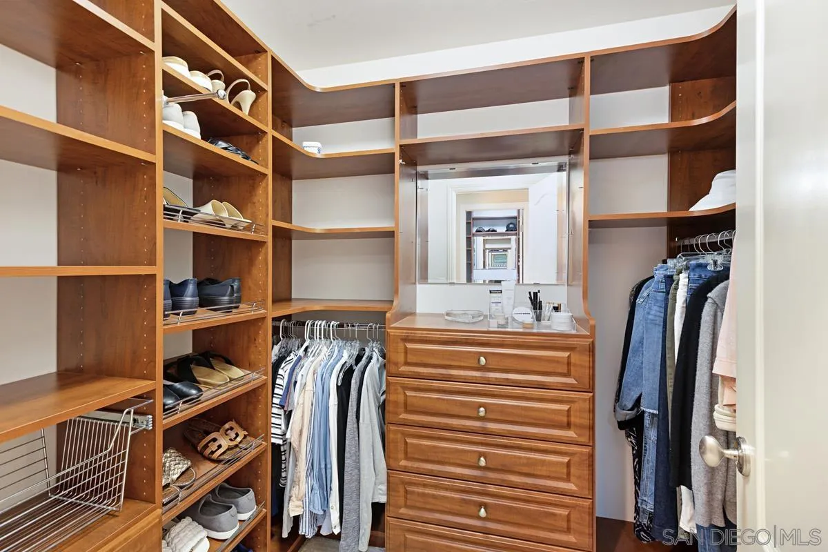 14258 Palisades Drive Poway, CA 92064 - Photo 18 of 40 a view of walk in closet with clothes and shoes