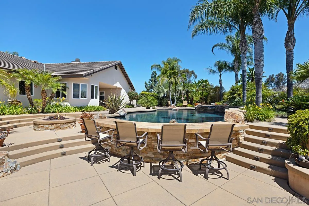 14258 Palisades Drive Poway, CA 92064 - Photo 36 of 40 a view of a patio with a dining table and chairs