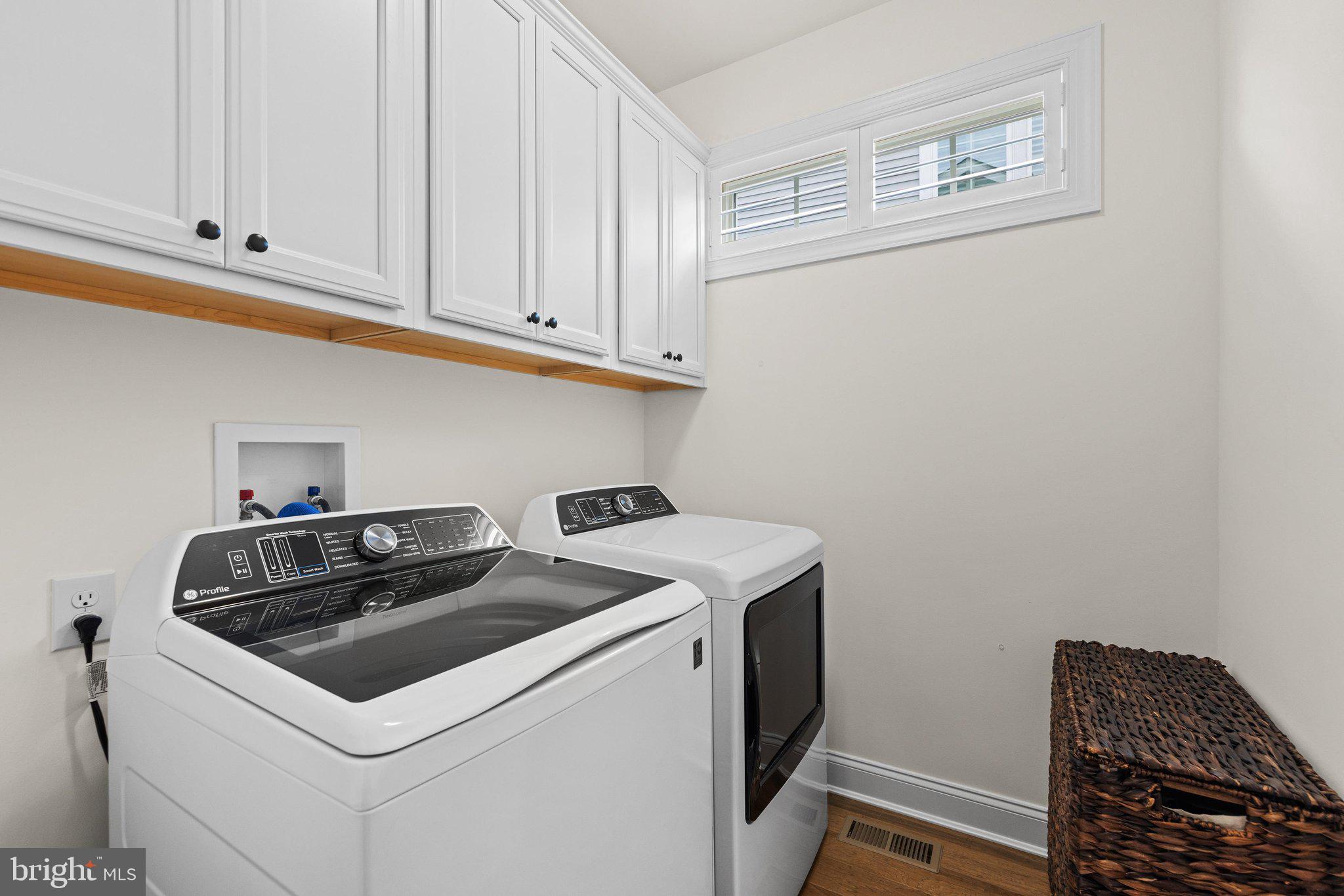 11119 Marvil Road Lewes, DE 19958 - Photo 35 of 56 Laundry with cabinets.