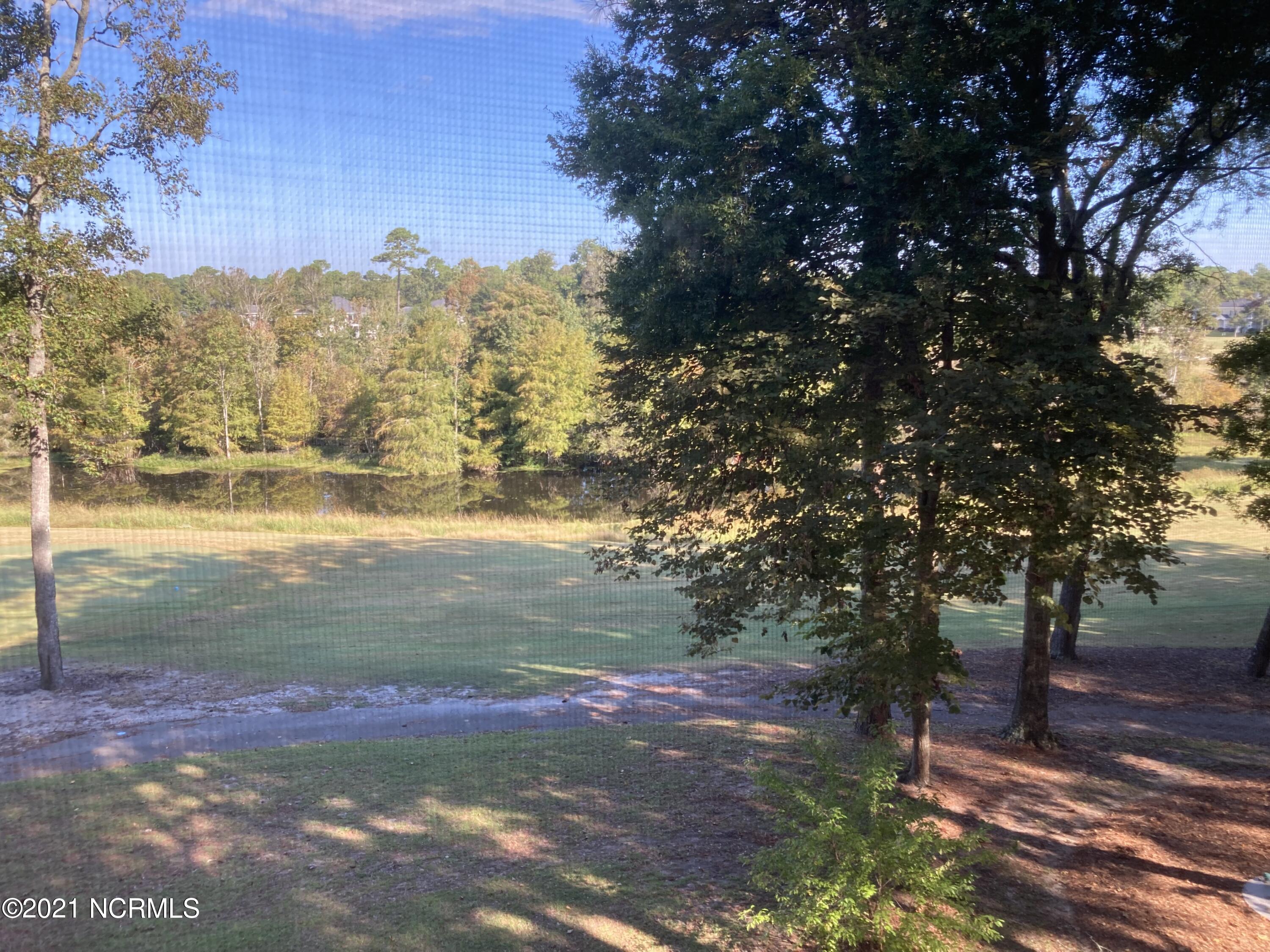 219 Clubhouse Road, Unit 406 Sunset Beach, NC 28468 - Photo 14 of 23 View from porch