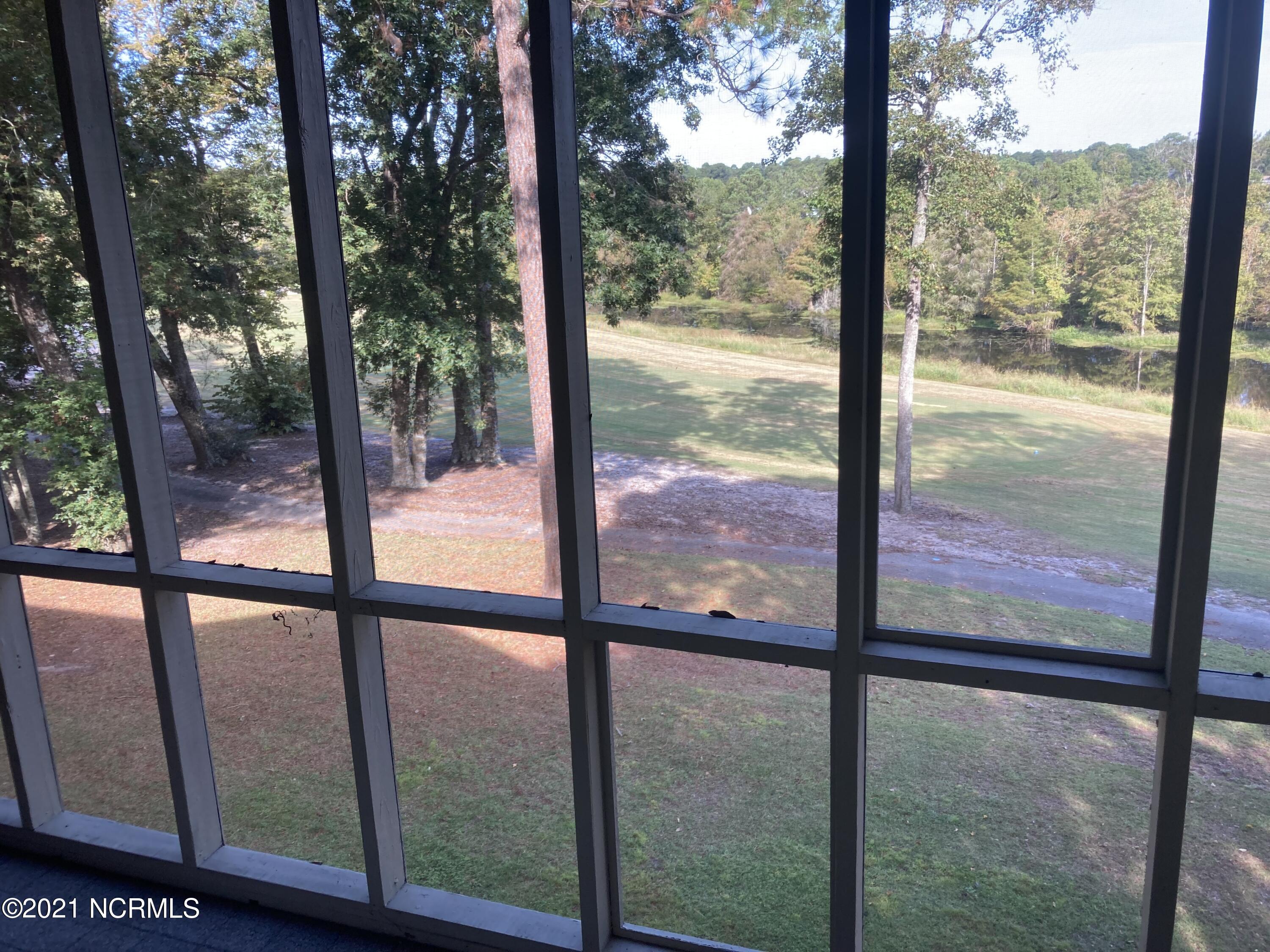219 Clubhouse Road, Unit 406 Sunset Beach, NC 28468 - Photo 15 of 23 Golf course view