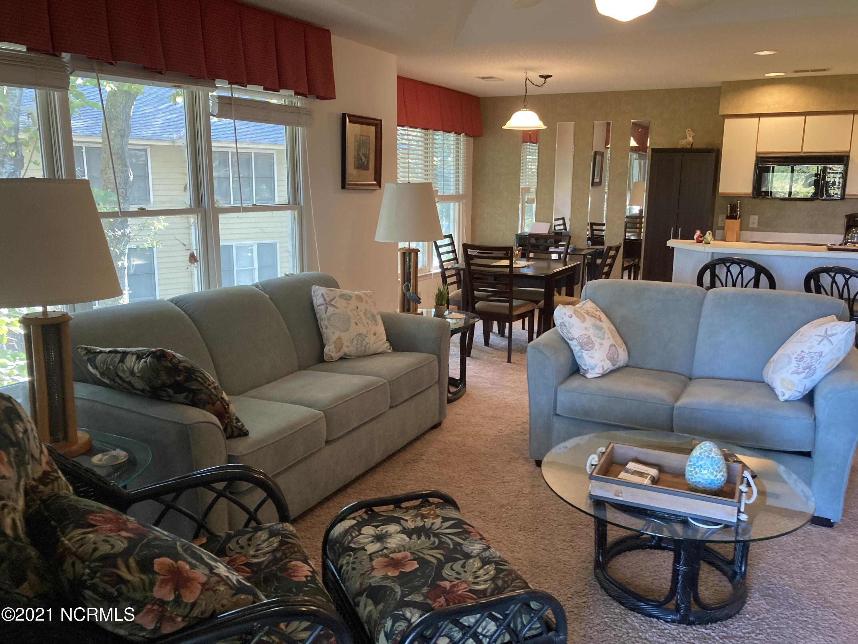219 Clubhouse Road, Unit 406 Sunset Beach, NC 28468 - Photo 7 of 23 Interior living from porch