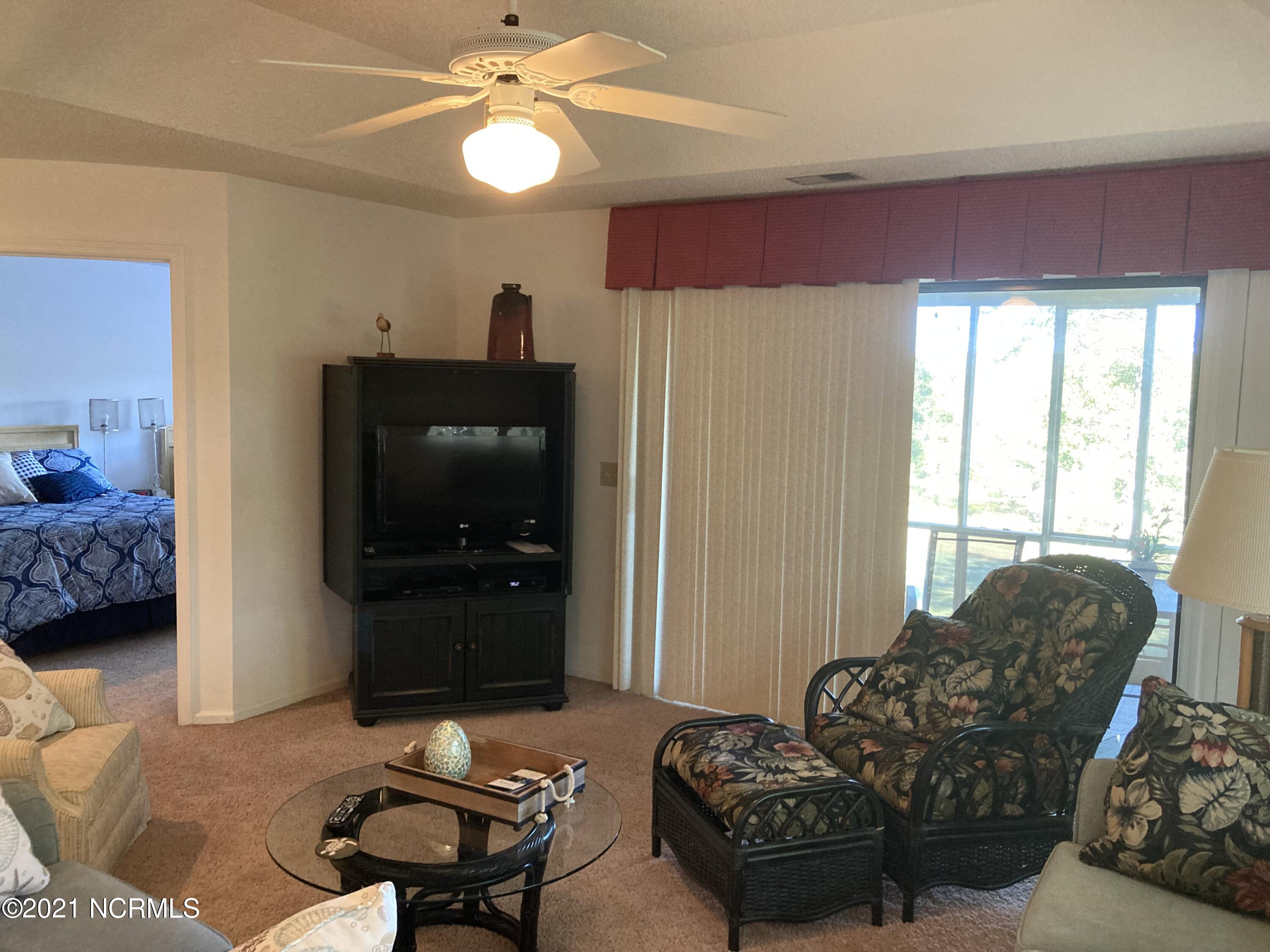 219 Clubhouse Road, Unit 406 Sunset Beach, NC 28468 - Photo 8 of 23 Master bedroom off Living Area