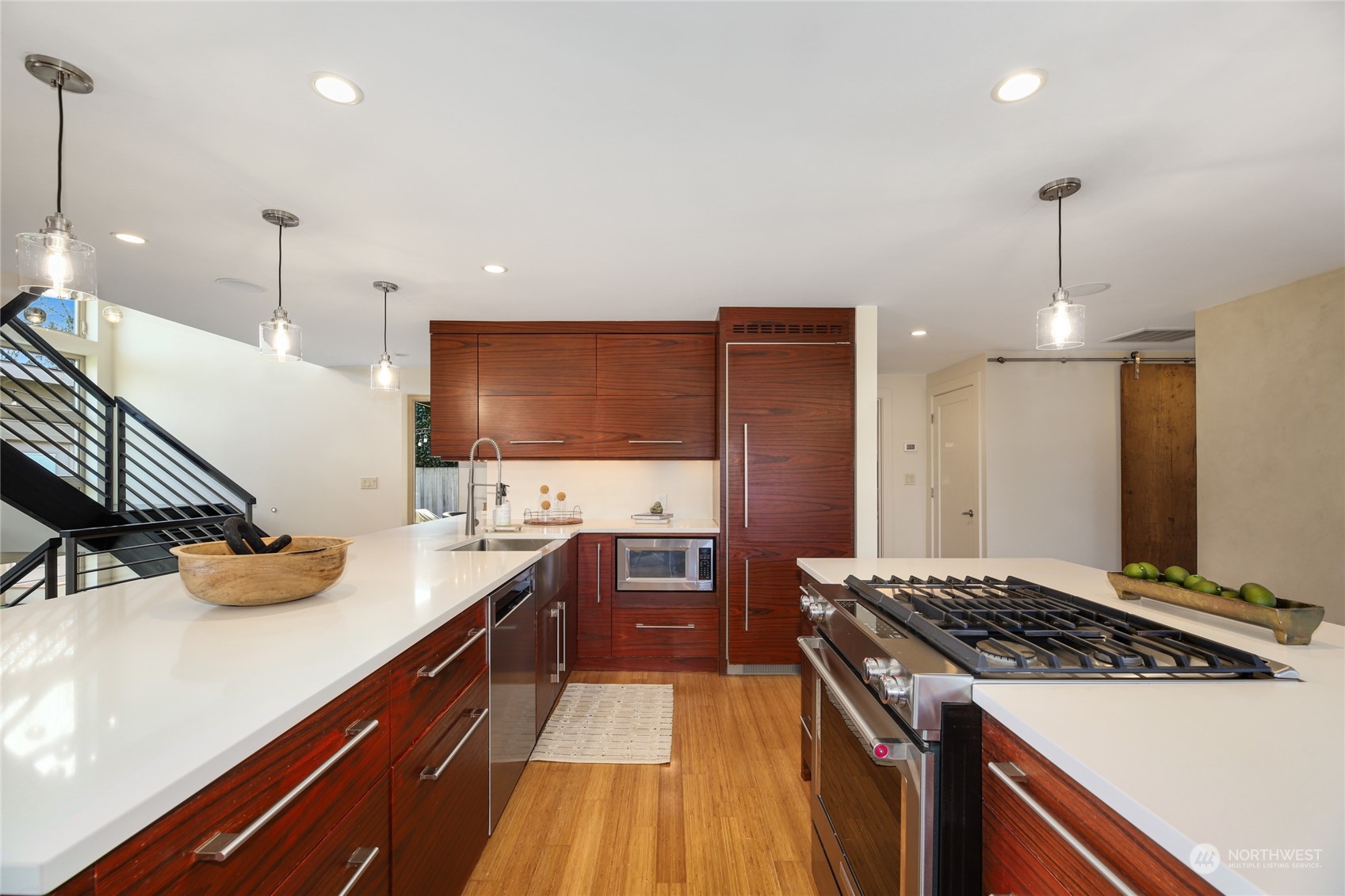 2148 Sunset Avenue Southwest Seattle, WA 98116 - Photo 11 of 40 a kitchen with stainless steel appliances a sink stove and refrigerator