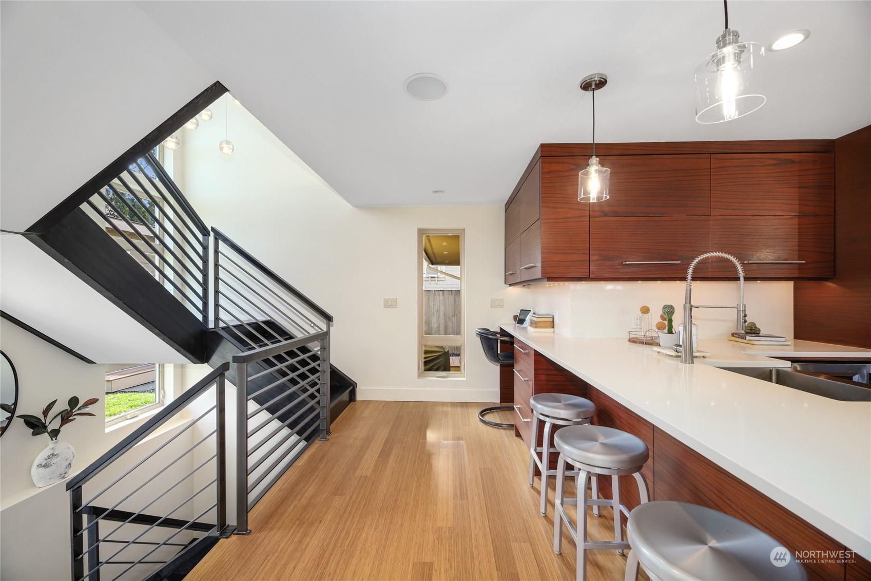 2148 Sunset Avenue Southwest Seattle, WA 98116 - Photo 14 of 40 a open kitchen with sink a refrigerator and wooden floor