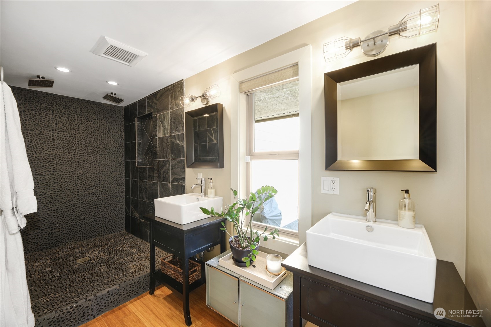 2148 Sunset Avenue Southwest Seattle, WA 98116 - Photo 19 of 40 a bathroom with a sink mirror and a shower