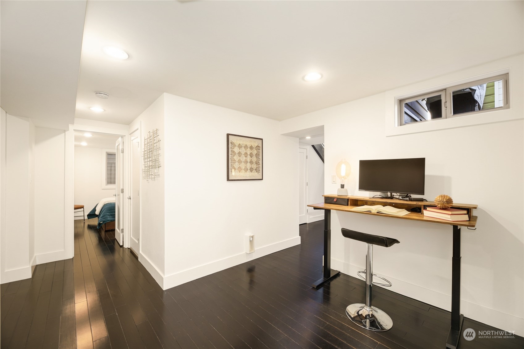 2148 Sunset Avenue Southwest Seattle, WA 98116 - Photo 29 of 40 a view of a workspace with furniture and wooden floor