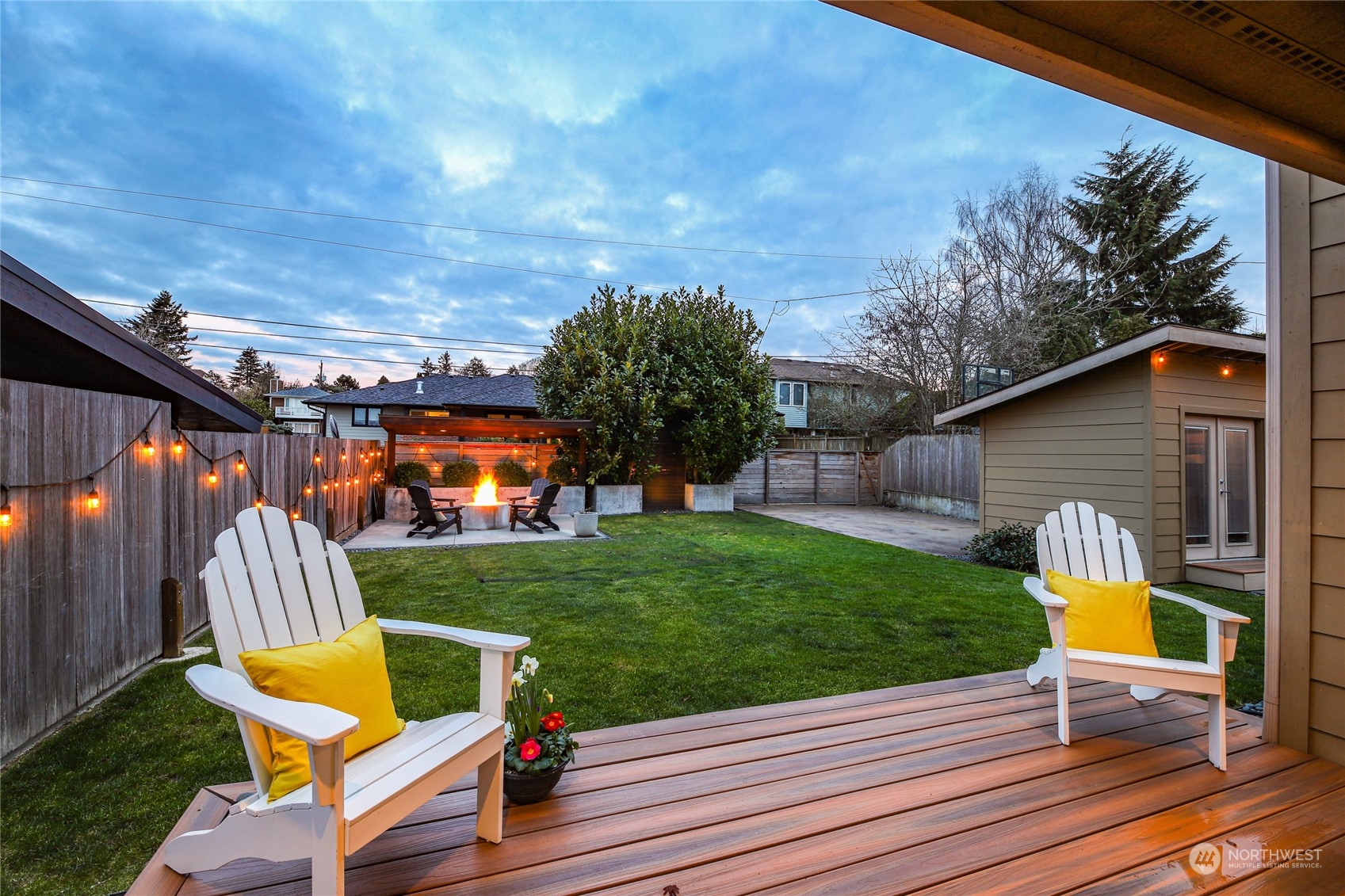 2148 Sunset Avenue Southwest Seattle, WA 98116 - Photo 34 of 40 a view of a backyard with couches chair and wooden fence