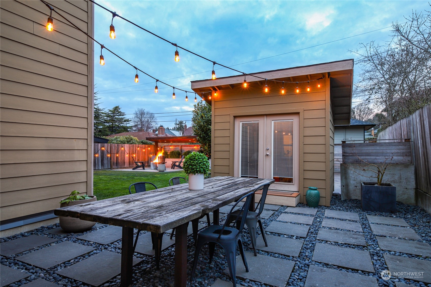 2148 Sunset Avenue Southwest Seattle, WA 98116 - Photo 37 of 40 a backyard of a house with barbeque oven table and chairs