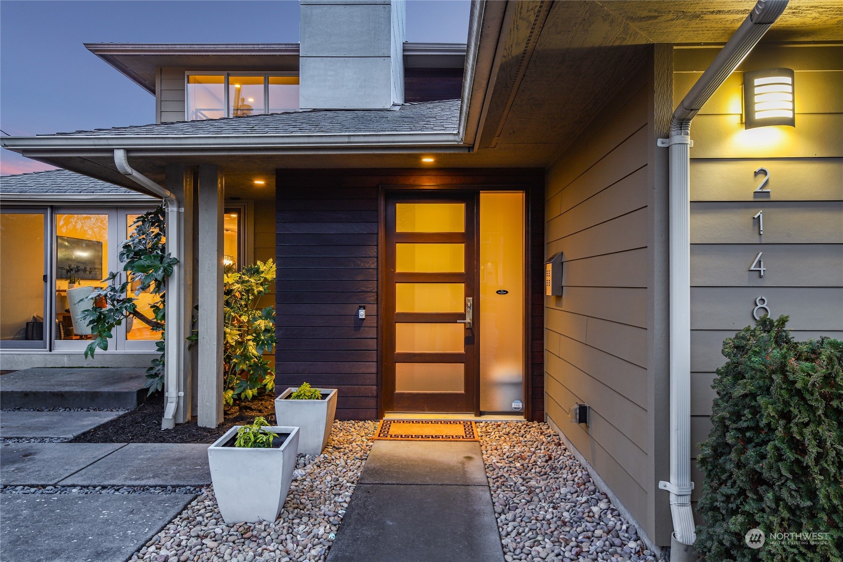 2148 Sunset Avenue Southwest Seattle, WA 98116 - Photo 4 of 40 a front view of a house with a potted plant