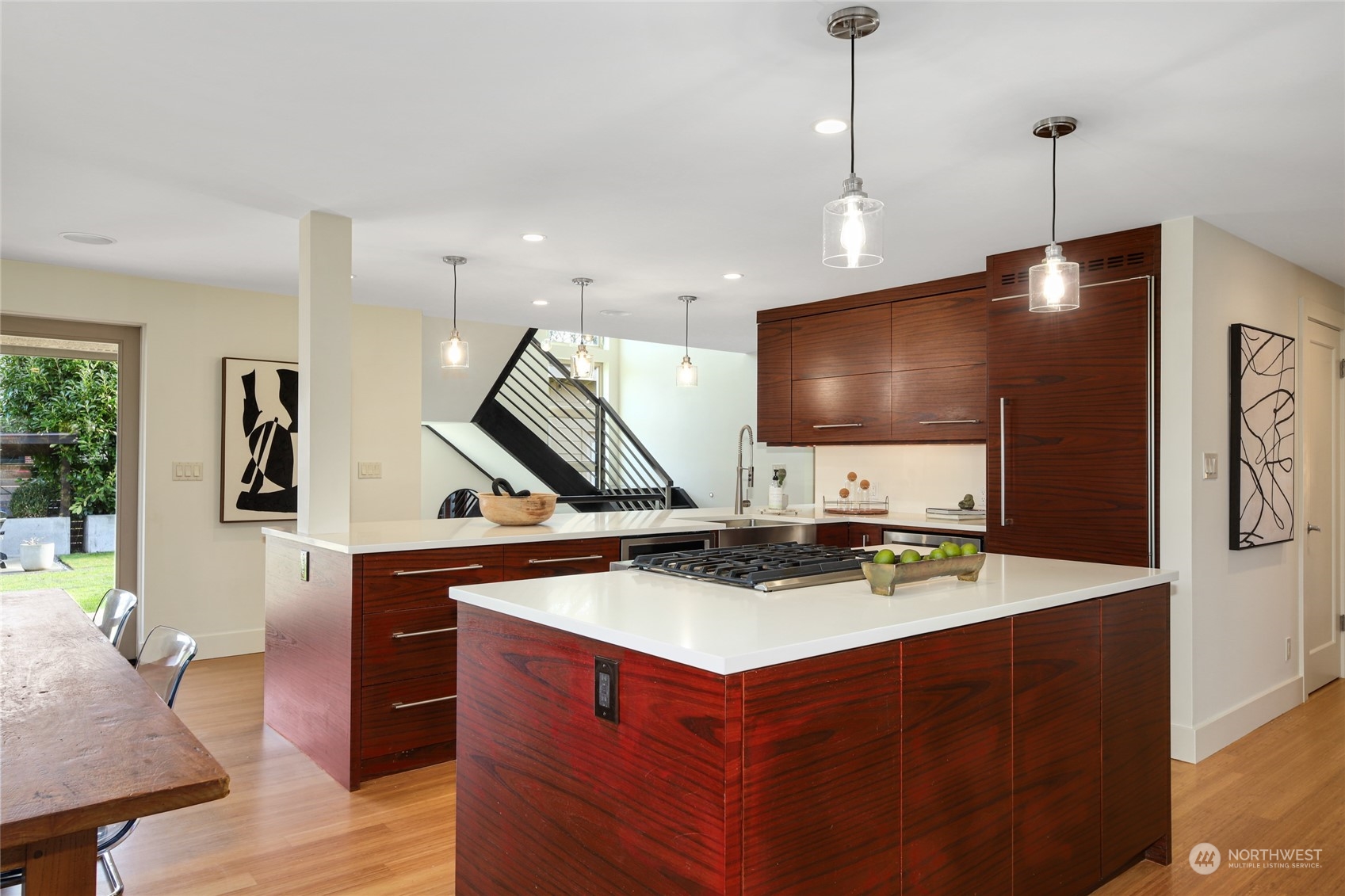 2148 Sunset Avenue Southwest Seattle, WA 98116 - Photo 10 of 40 a kitchen with stainless steel appliances kitchen island a cabinets and wooden floor