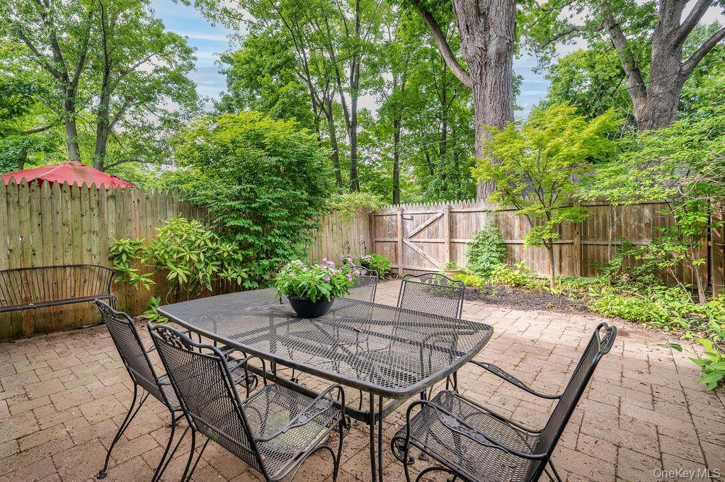 30 Pondview Road, Unit K Rye, NY 10580 - Photo 8 of 22 Back gate leads to additional green space and garages.