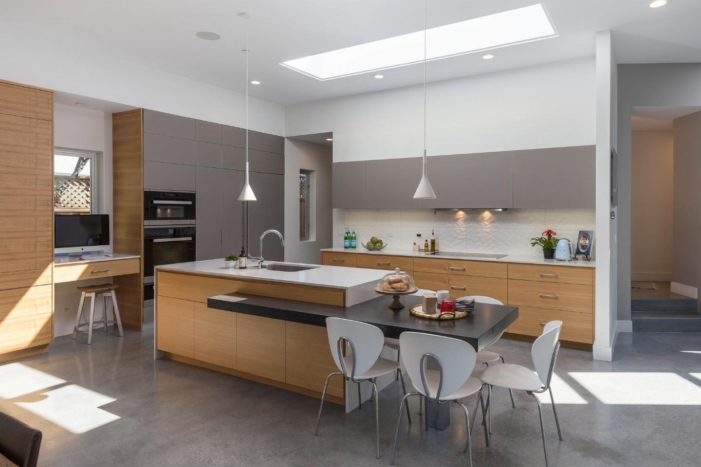 454 Cypress Drive Los Altos, CA 94022 - Photo 8 of 35 a kitchen with stainless steel appliances a table and chairs in it
