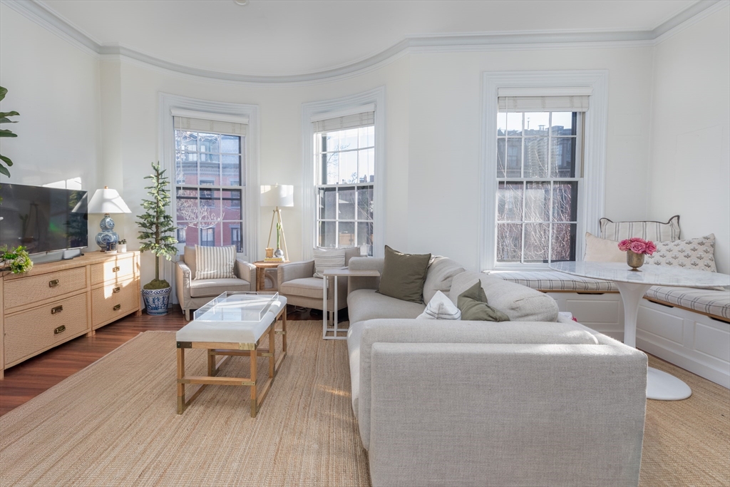 83 Montgomery Street, Unit 2 Boston, MA 02116 - Photo 1 of 11 a living room with furniture and a flat screen tv