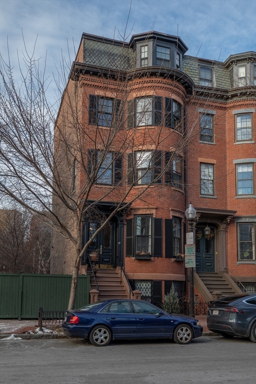 83 Montgomery Street, Unit 2 Boston, MA 02116 - Photo 9 of 11 a front view of a house with a yard