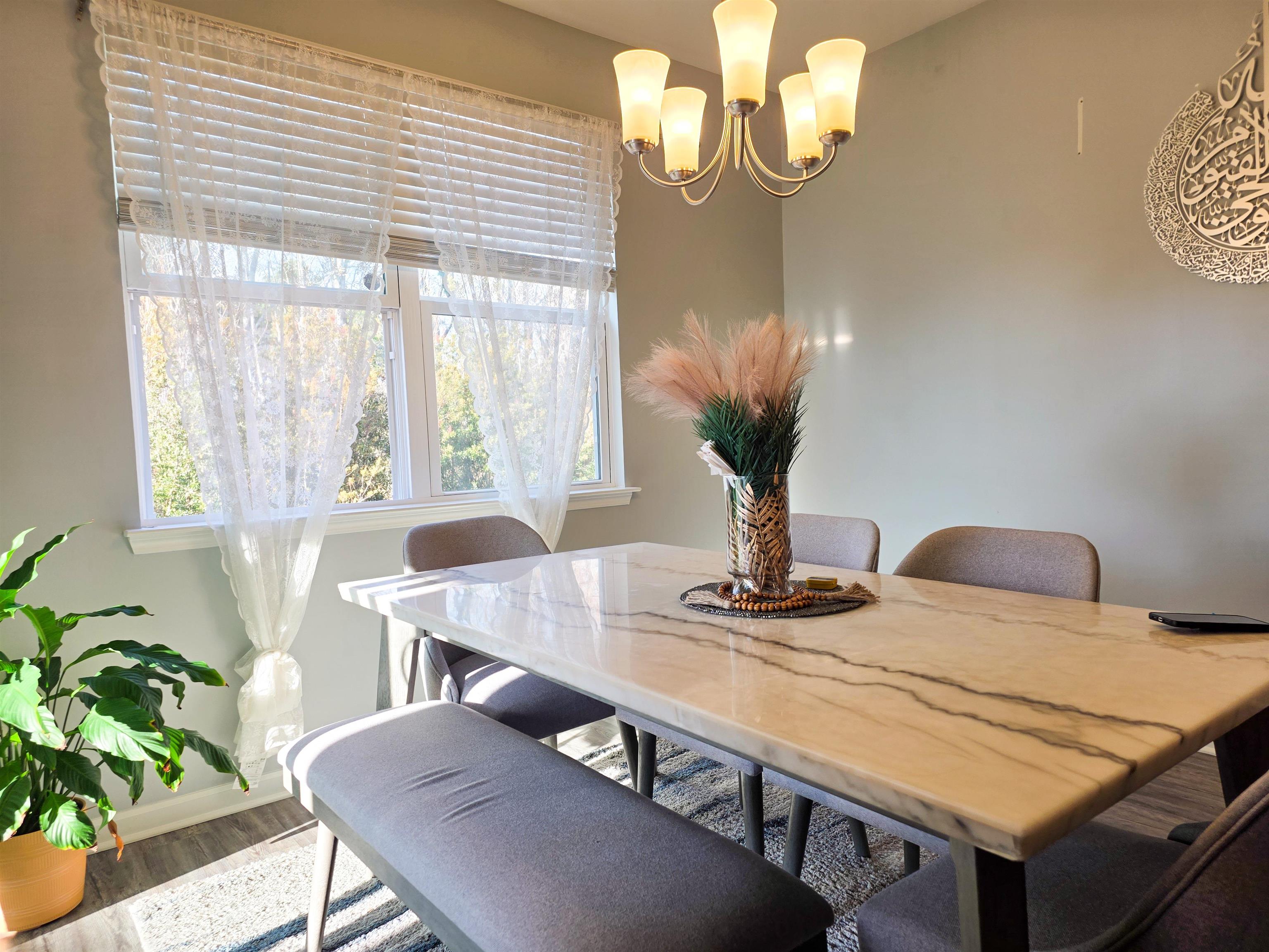 212 Legends Drive Myrtle Beach, SC 29579 - Photo 15 of 18 Dining area with a chandelier and wood finished floors