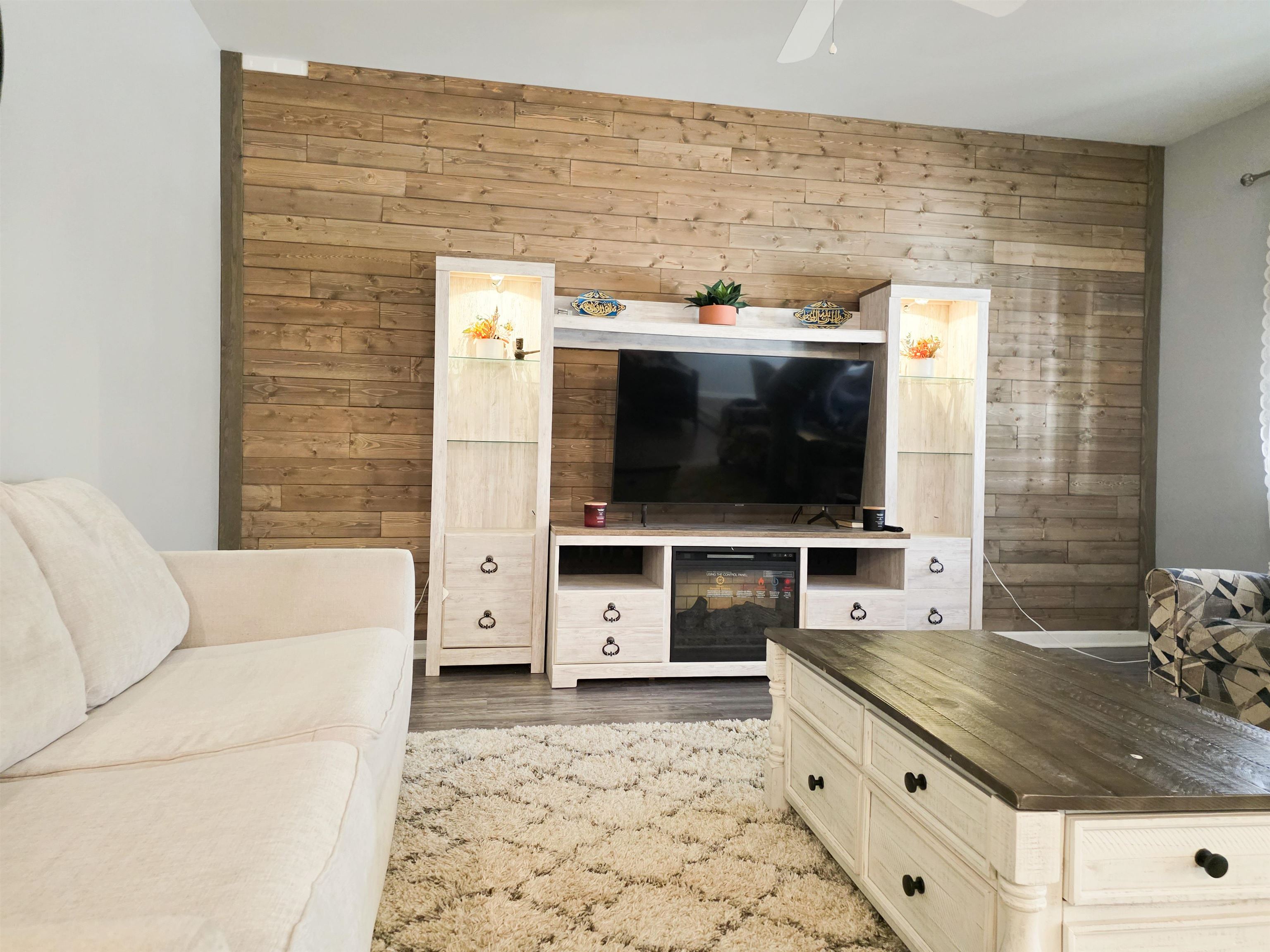 212 Legends Drive Myrtle Beach, SC 29579 - Photo 16 of 18 Living area with wooden walls and wood finished floors