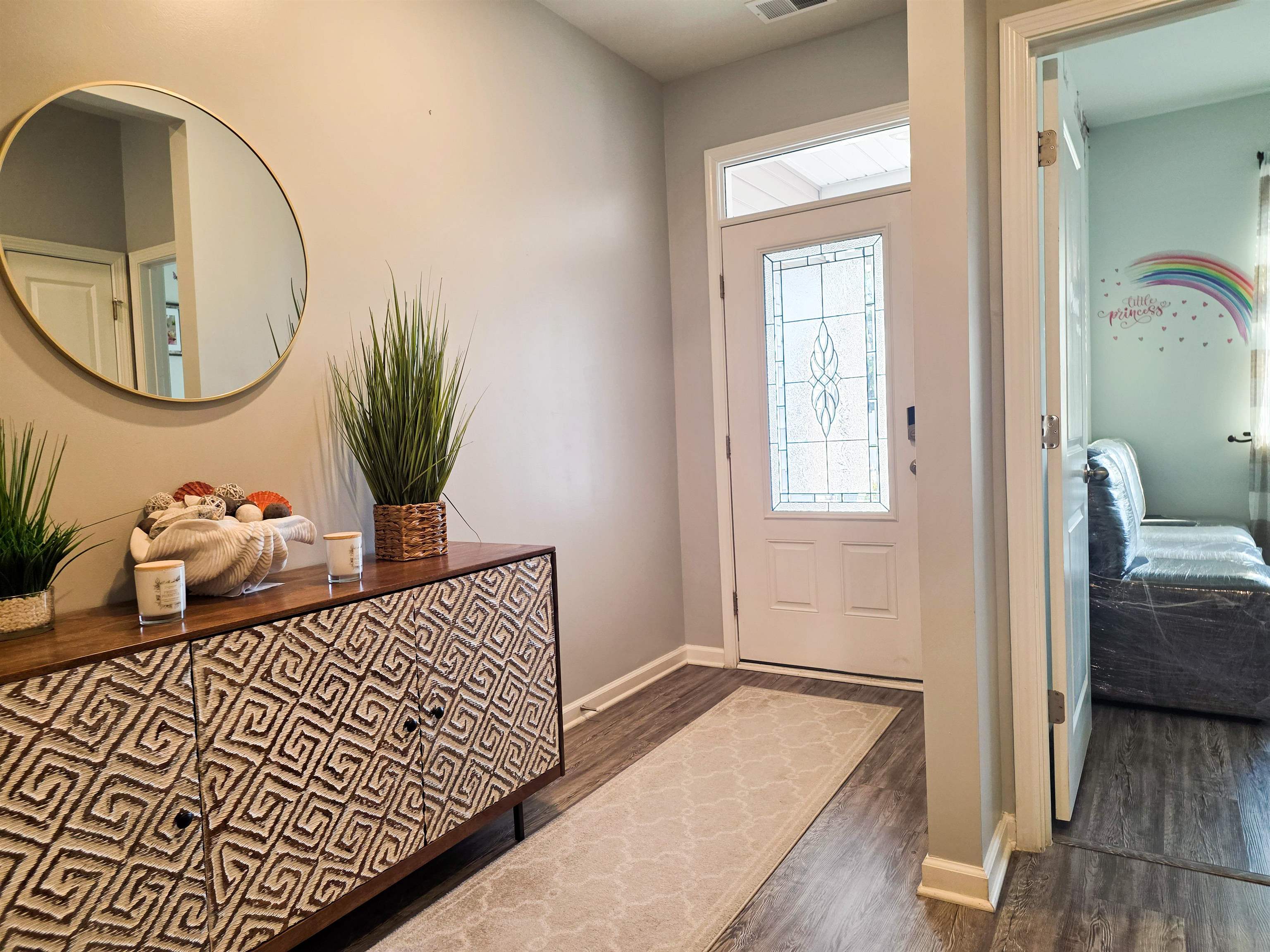 212 Legends Drive Myrtle Beach, SC 29579 - Photo 2 of 18 Entryway with dark wood finished floors and baseboards