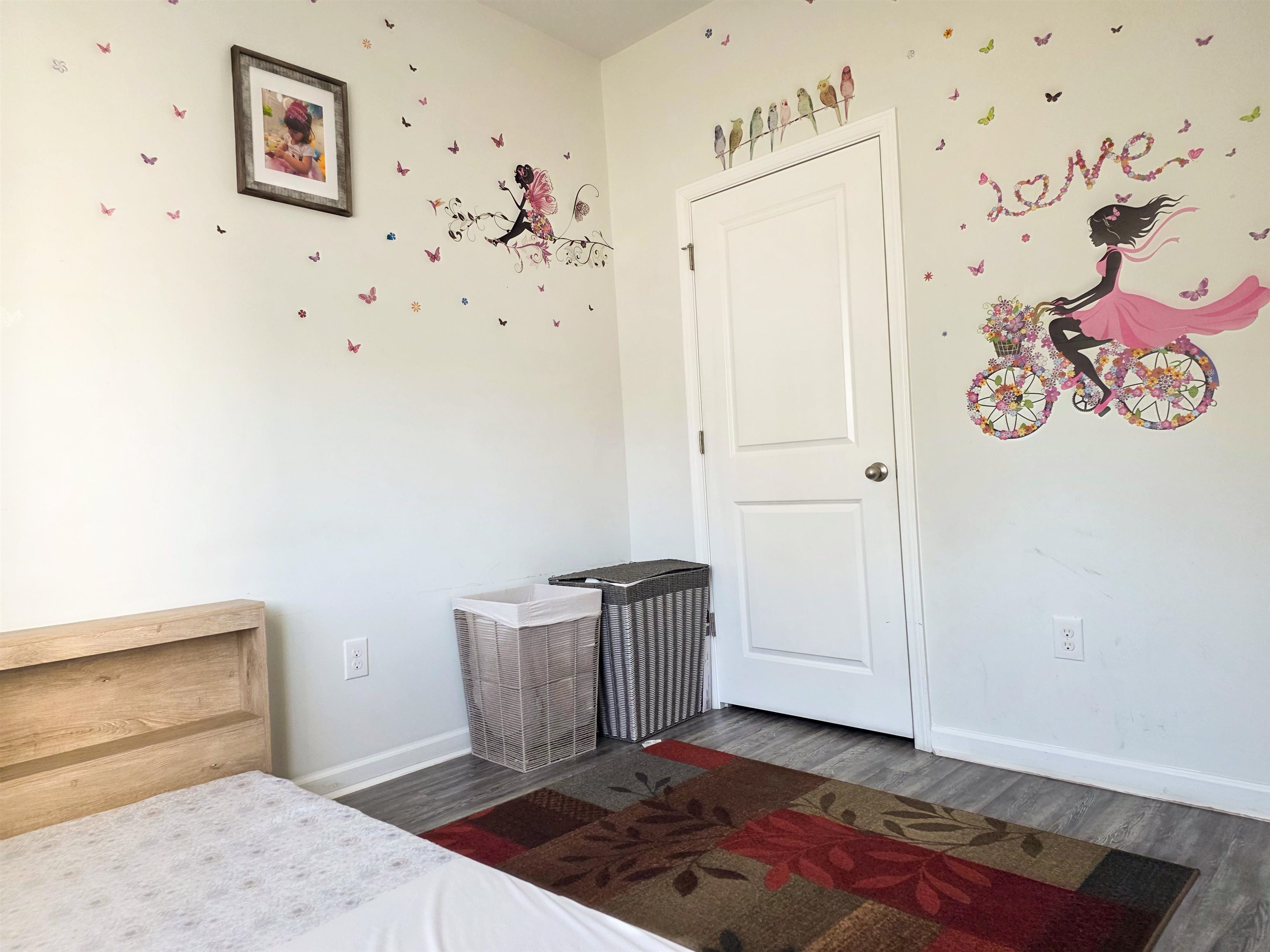 212 Legends Drive Myrtle Beach, SC 29579 - Photo 9 of 18 Bedroom with dark wood-type flooring and baseboards