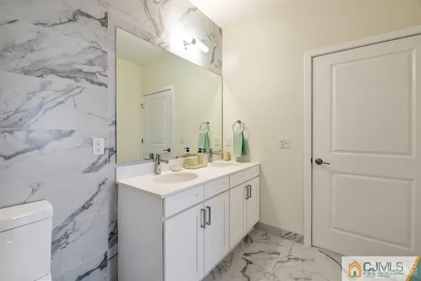 a living room with furniture a flat screen tv and a large window