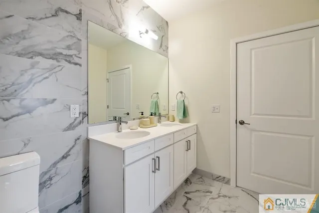 a living room with furniture a flat screen tv and a large window