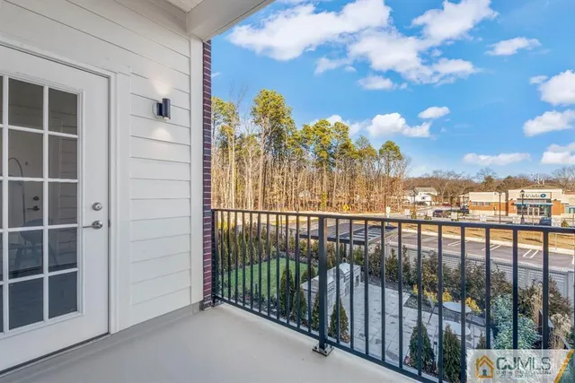 a view of a patio with couches and a table and chairs