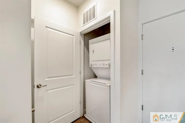 a view of a room with wooden floor and window