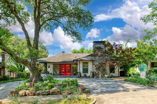 a front view of a house with yard