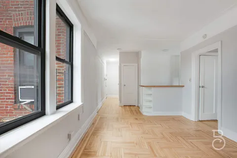 a view of a hallway with a staircase