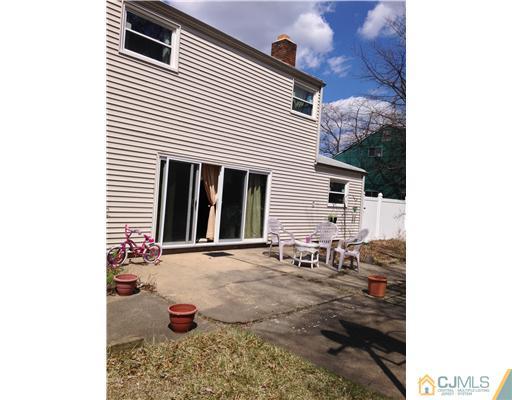 60 Eardley Road Edison, NJ 08817 - Photo 2 of 17 a backyard of a house with outdoor seating